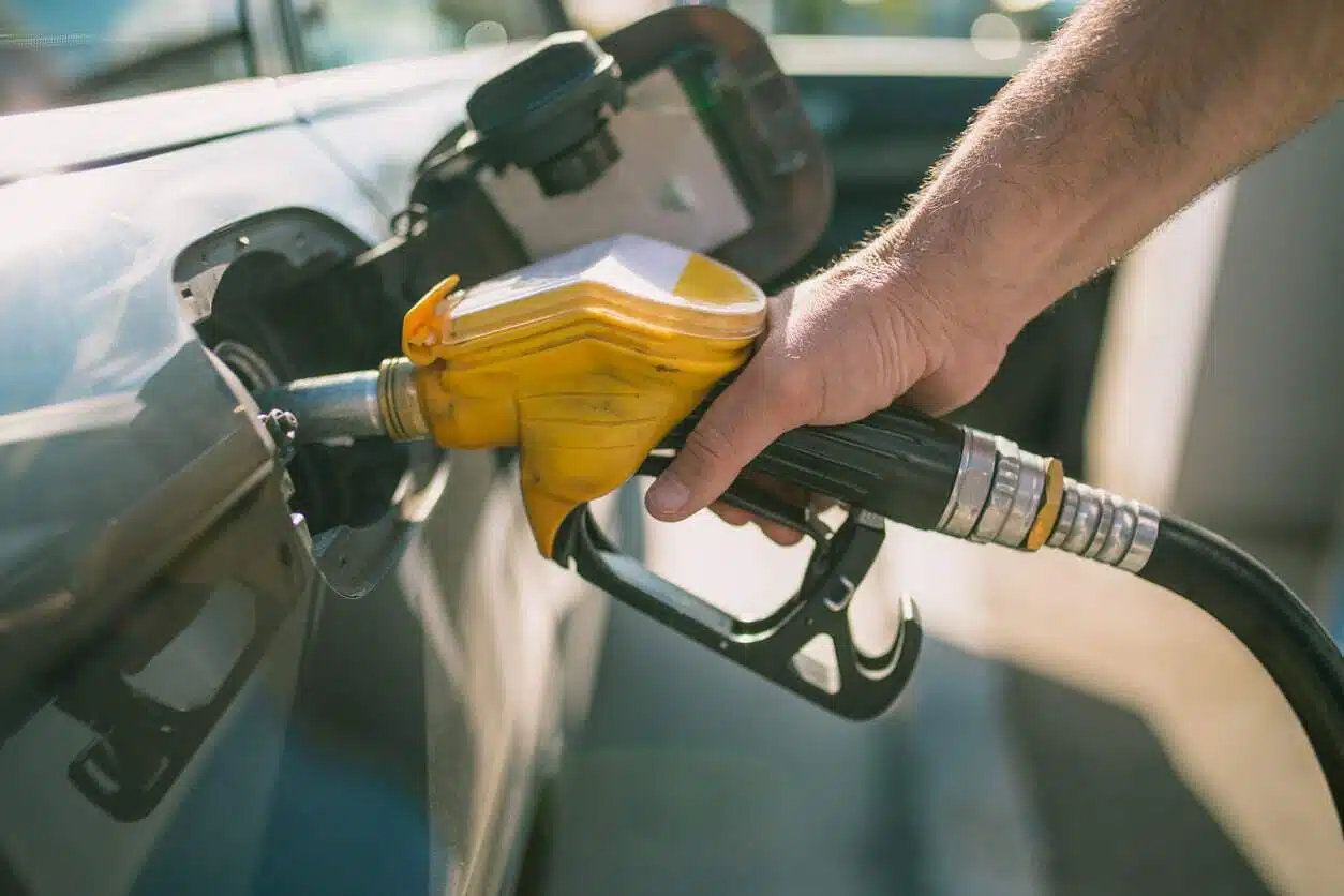 Car refueling on petrol station. Man pumping gasoline oil. This photo can be used for automotive industry or transportation concept