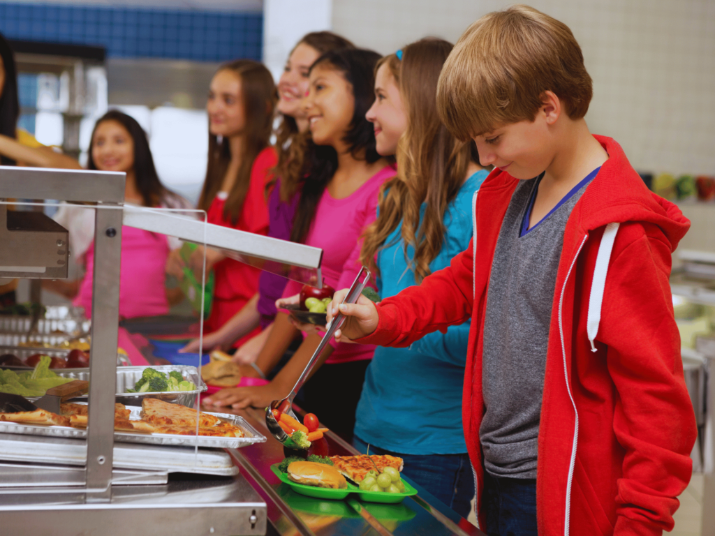 kids in line for lunch at a school that recycles cooking oil