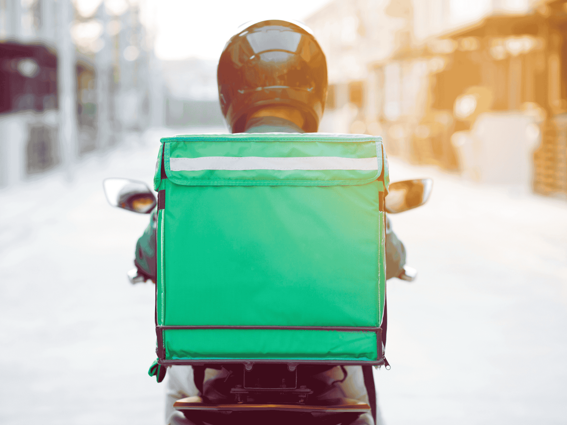 Deliveroo driver collecting food from dark kitchen facility